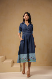 Front view of Woodland Muse Midi Dress in breathable denim with floral meadow embroidery and chipmunk detail