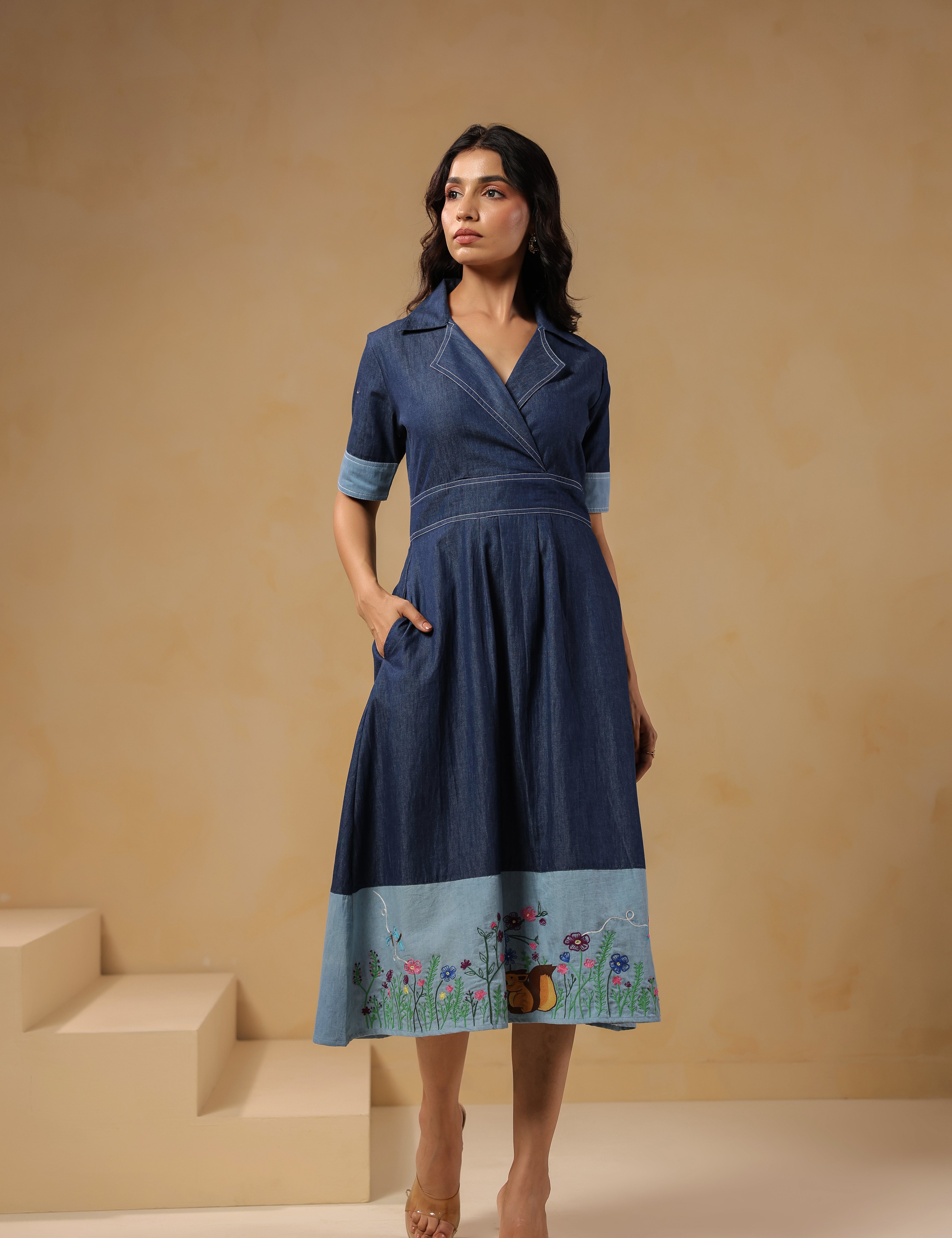 Front view of Woodland Muse Midi Dress in breathable denim with floral meadow embroidery and chipmunk detail