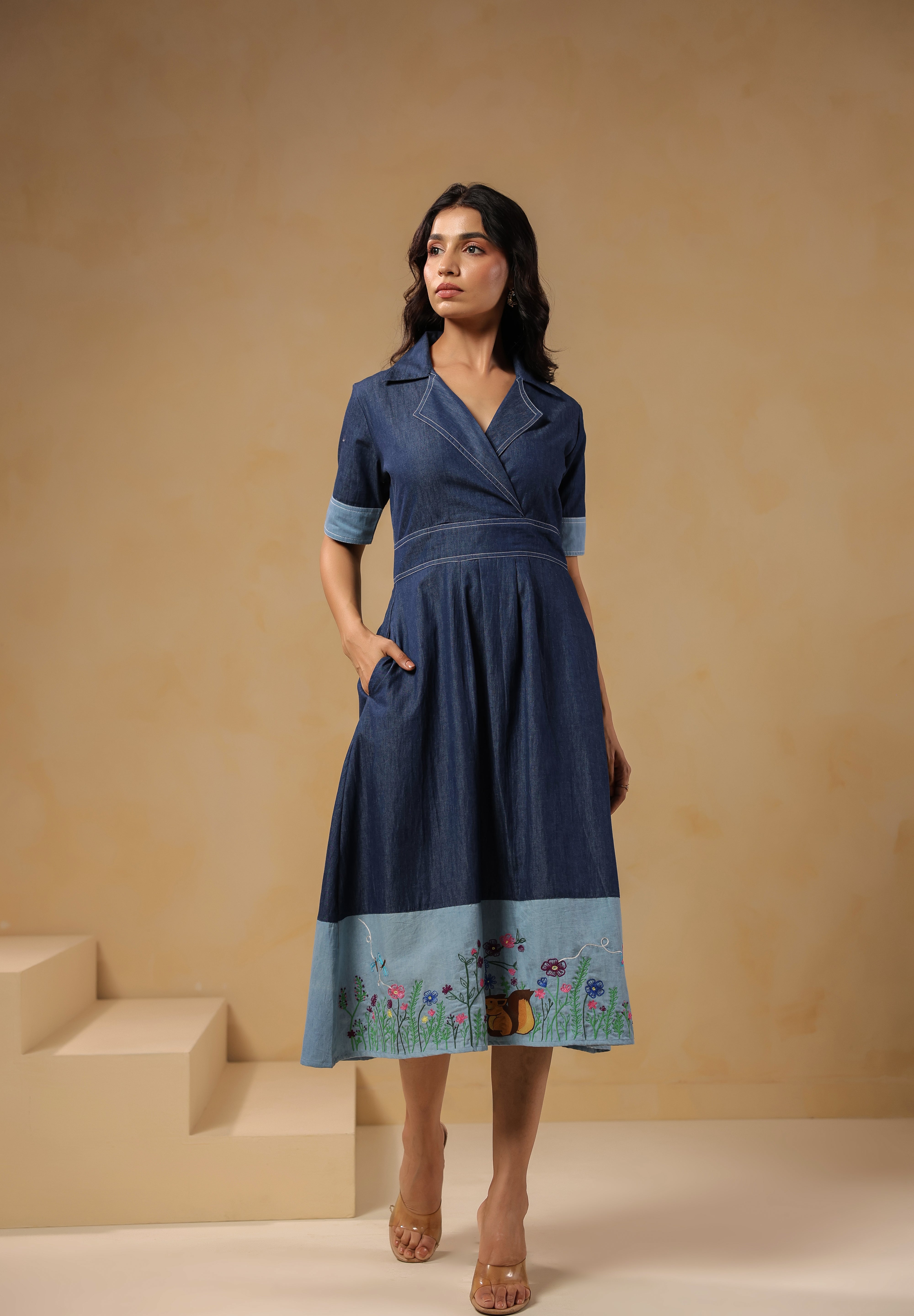 Front view of Woodland Muse Midi Dress in breathable denim with floral meadow embroidery and chipmunk detail