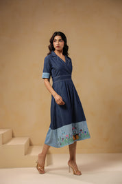 Side profile of Woodland Muse Midi Dress showing wrap-style neckline and structured fit